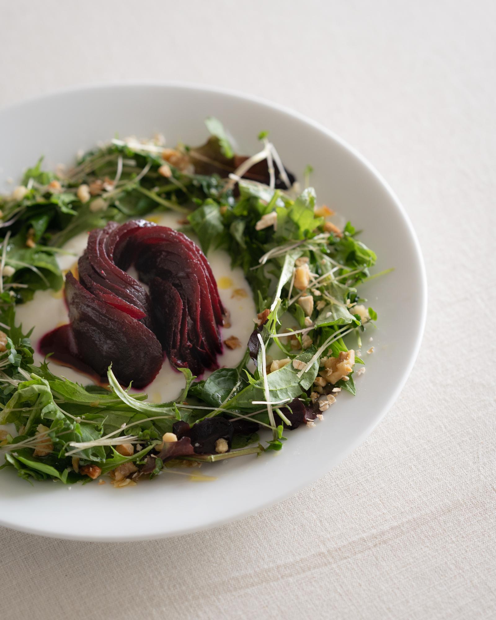 Plated seasonal entrée with microgreens
